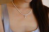 Akoya Pearl Spade Pendant Necklace detail view featuring Akoya pearl and gold-plated silver by S.Journee